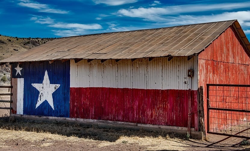 Clean Energy - Image of barn in Texas with flag
