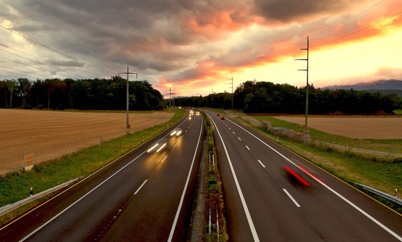 Fuel Cell Vehicles - Cars on Highway at Sunset