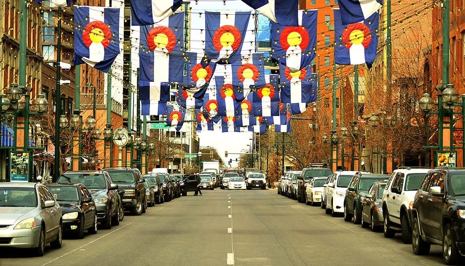 Clean Vehicles - Street in Colorado with Colorado Flags