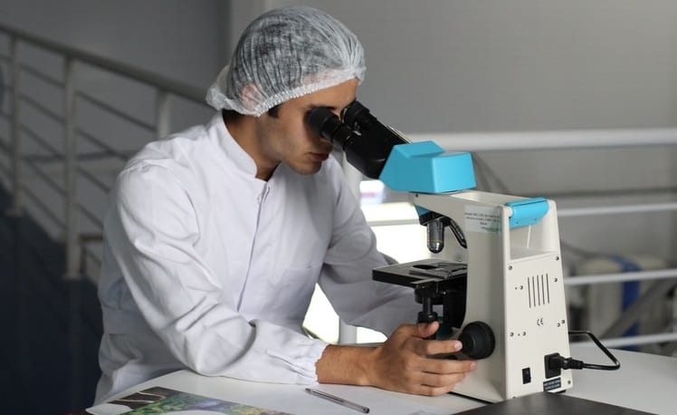 Swansea University - Researchers - Scientist using microscope
