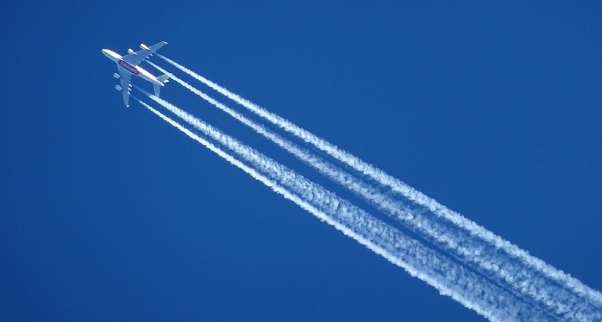 Contrail climate impact - airplane leaving behind contrails