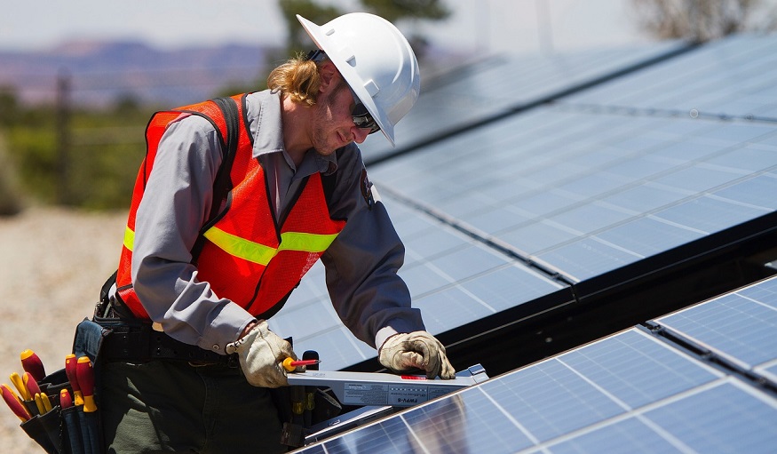 Pennsylvania green energy - person installing solar panels