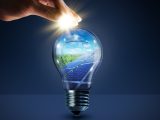 Solar energy - Sunlight at fingertips and lightbulb