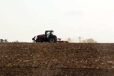 Solar Energy - Farm Field with Tractor