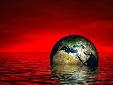 Climate Change - Globe  sinking in water