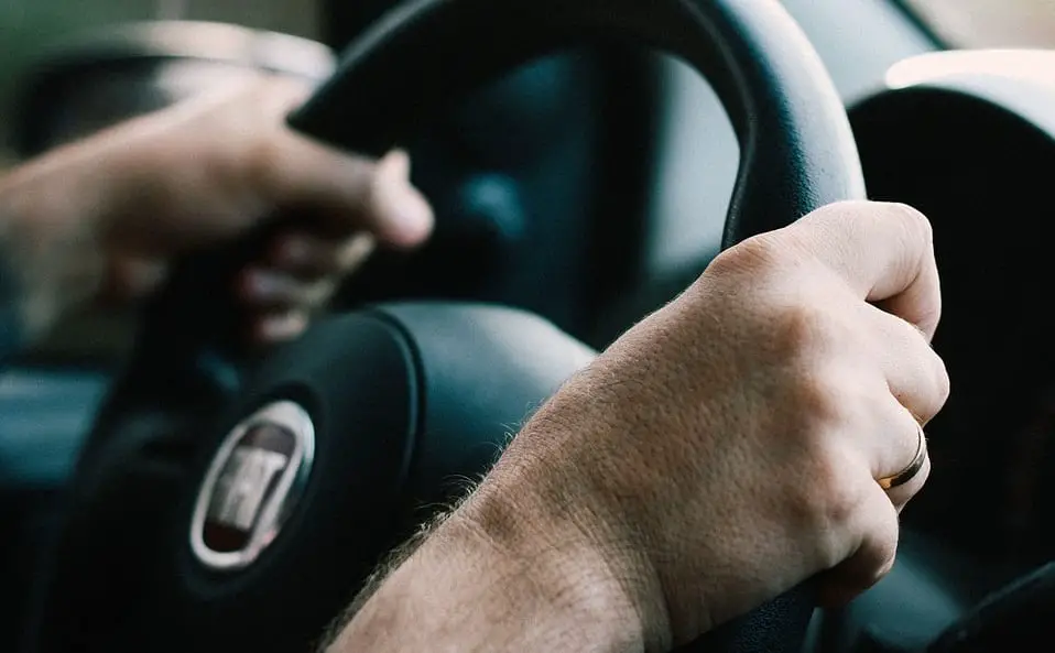 Electric Vehicles - driver holding steering wheel