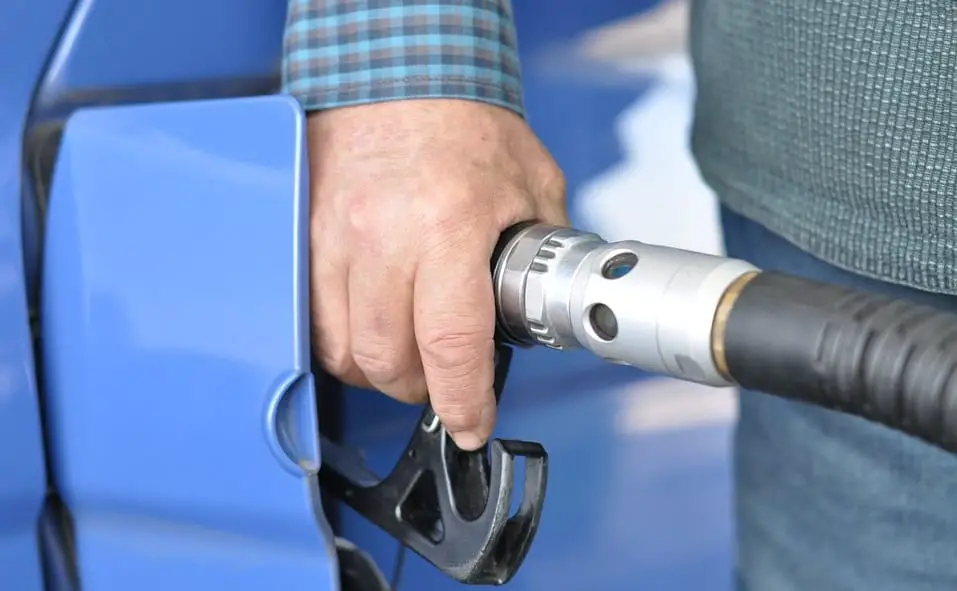 Hydrogen Fuel Stations - Man Refueling Car at gas station