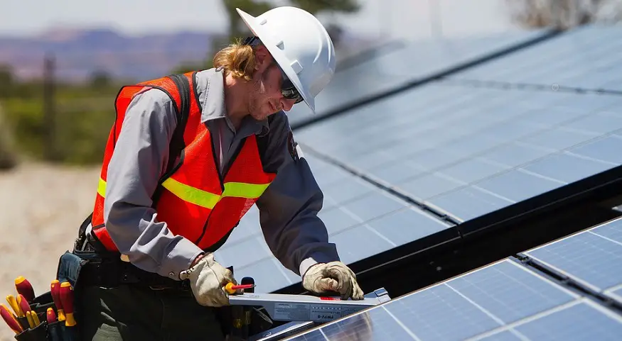 Renewable Energy Jobs - Man with solar panels