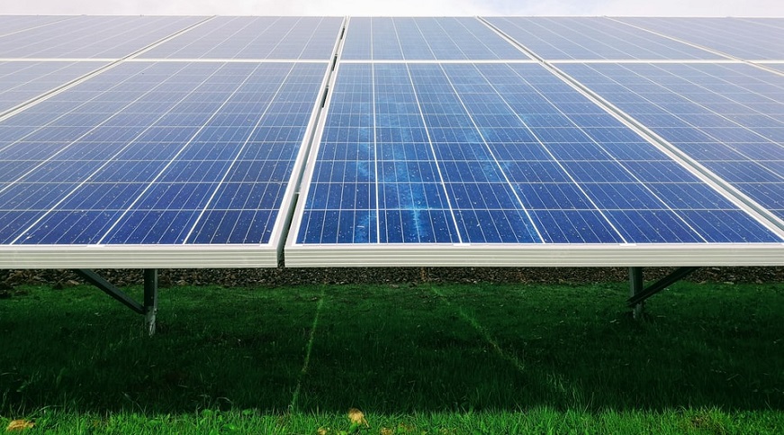 solar energy storage - solar panels on grass