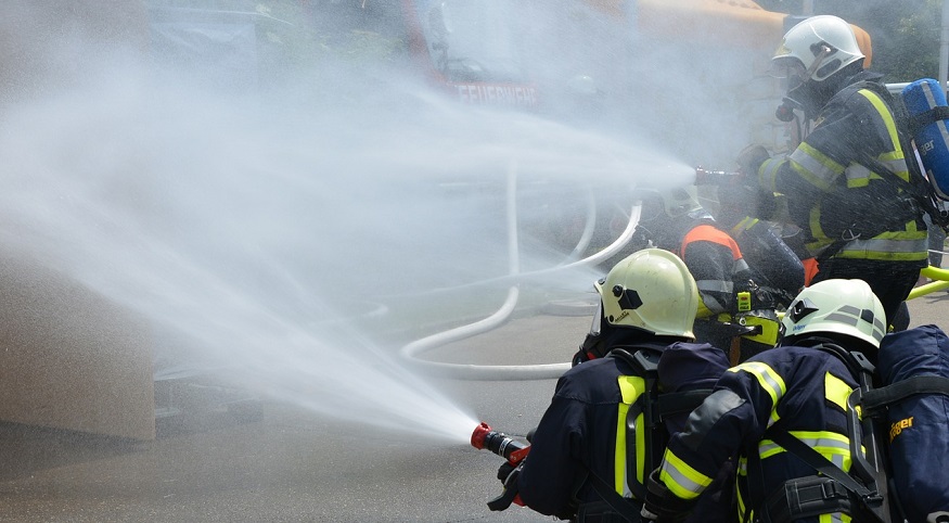 Hydrogen Fuel Cell Plant - Firefighters with hoses and water