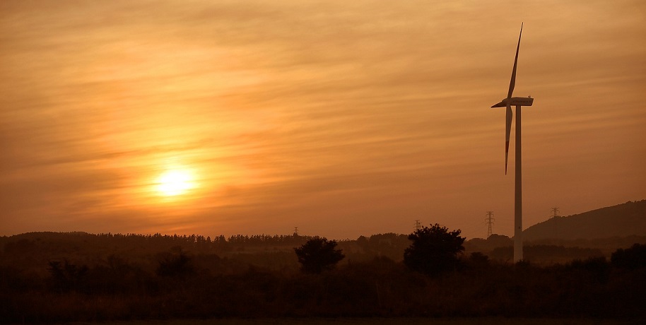 Green Hydrogen production facility - Wind farm at sunset