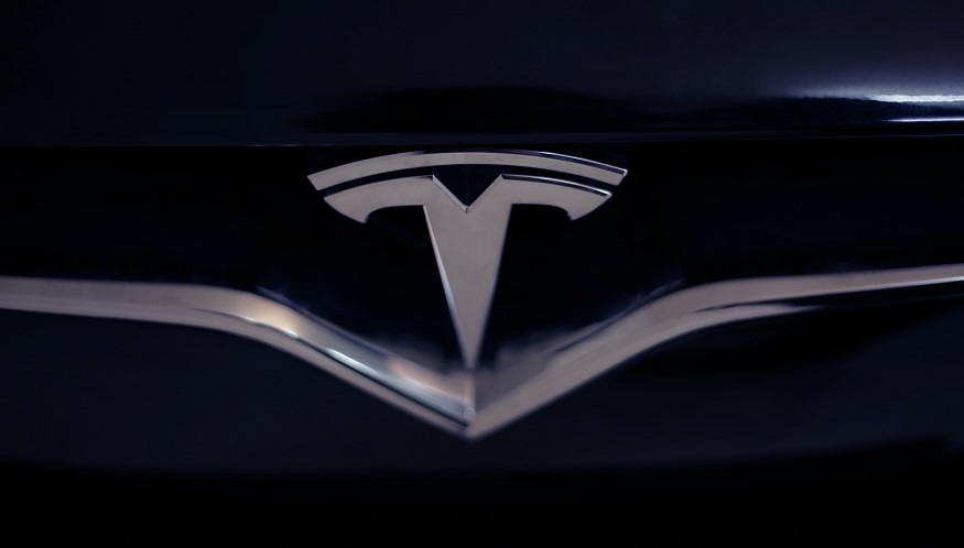 Tesla Shares - Tesla Logo on car