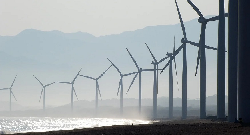 Taiwan renewable energy - wind turbine farm near beach