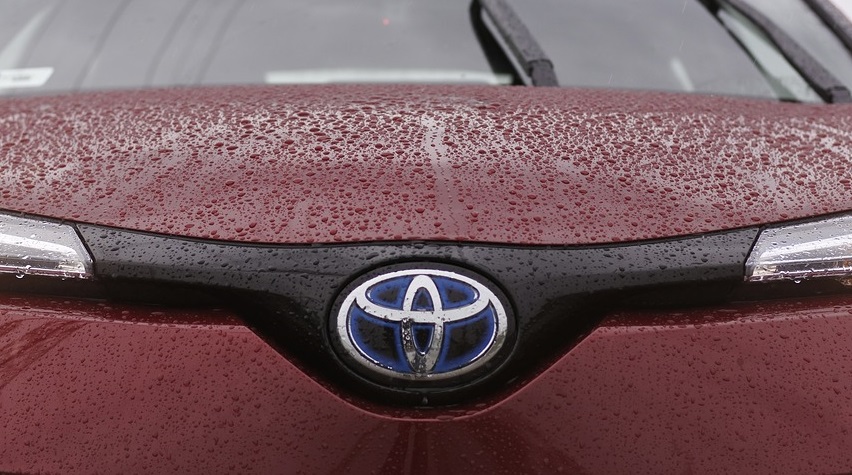 Fuel Cell Business Group - Toyota logo on car with water droplets