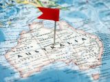 Green hydrogen production - Flag marking Australia on a map