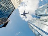 Hydrogen fuel aircraft - airplane above buildings