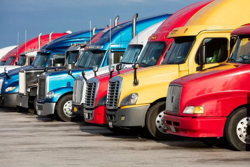 Autonomous fuel cell trucks - Different colored trucks parked