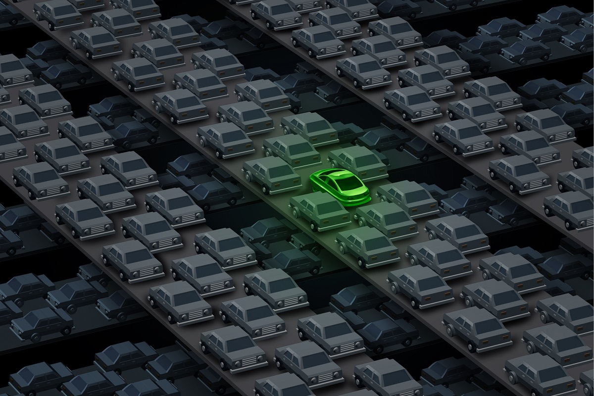 Hydrogen fuel cell cars - Image of green car surrounded by gray cars on road