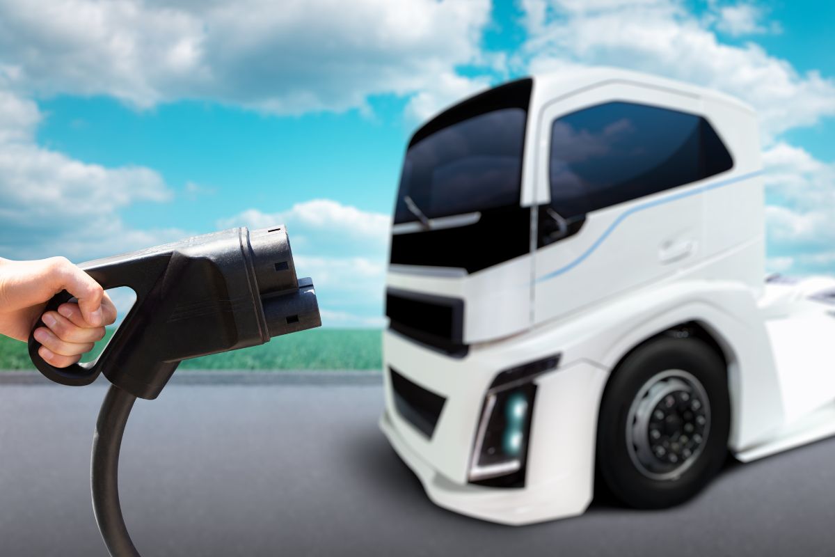 Nikola Tre BEV - Image of a EV charger and a truck