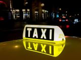 Hydrogen Taxis - Image of Taxi sign on top of car