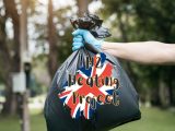 Hydrogen heating - UK Flag - Person holding garbage bag