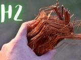 Green Hydrogen - Person holding copper metal