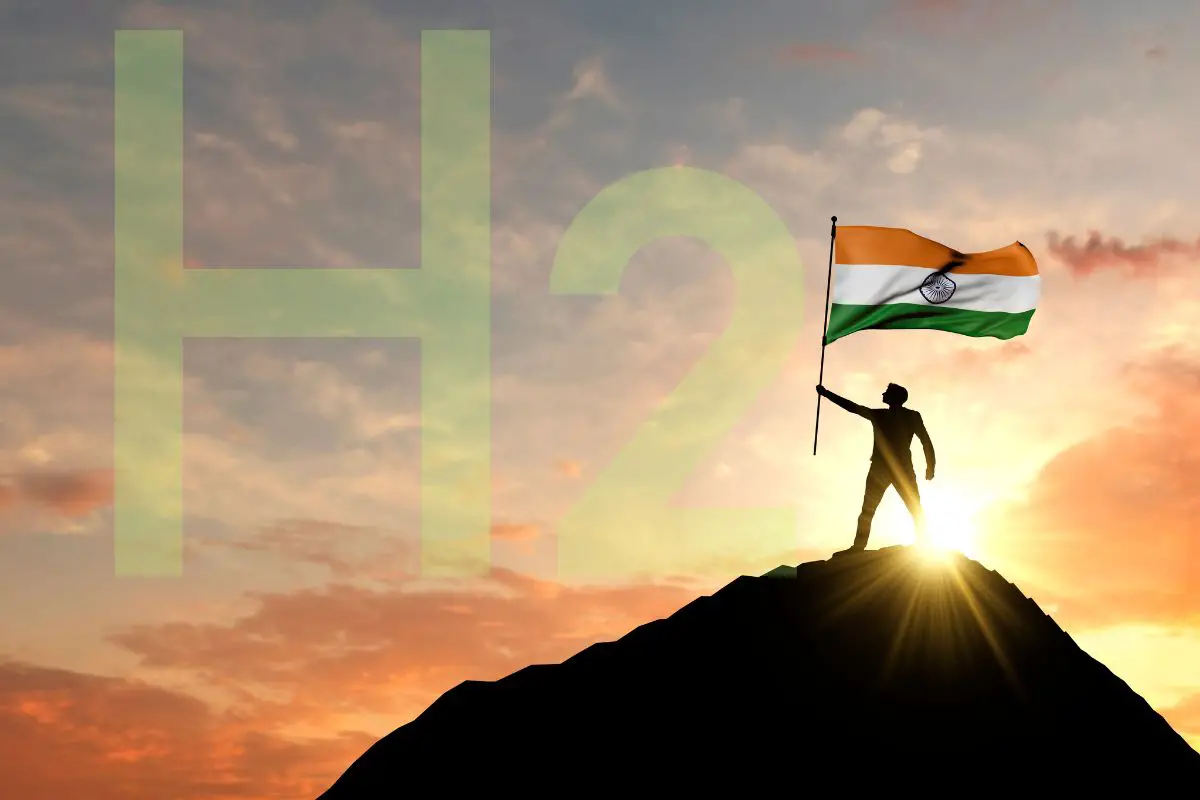Green Hydrogen - Person standing on mountain holding India's Flag