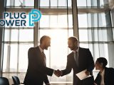 Professionals shaking hands upon Plug Power contract signing